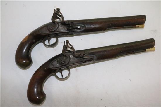 A pair of early 19th century flintlock holster pistols, signed Weston, Lewes, 15in.